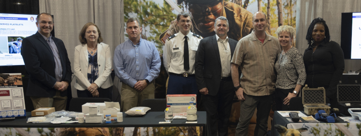 Team members with the U.S. Army Medical Materiel Development Activity gather for a photo
