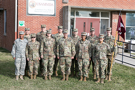 Thirteen members of the U.S. Army Medical Service Corps assigned to the U.S. Army Medical Materiel Development Activity, Fort Detrick, Maryland