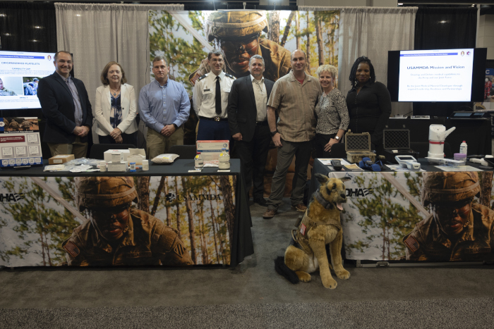 Team members with the U.S. Army Medical Materiel Development Activity gather for a photo