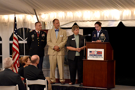 U.S. Air Force Lt. Col. Melinda Eaton accepts award