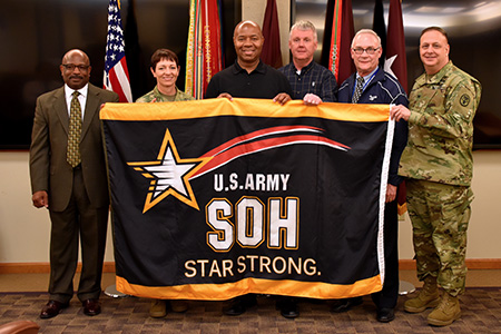 USAMMDA presented with the Army Safety and Occupational Health Star Strong flag